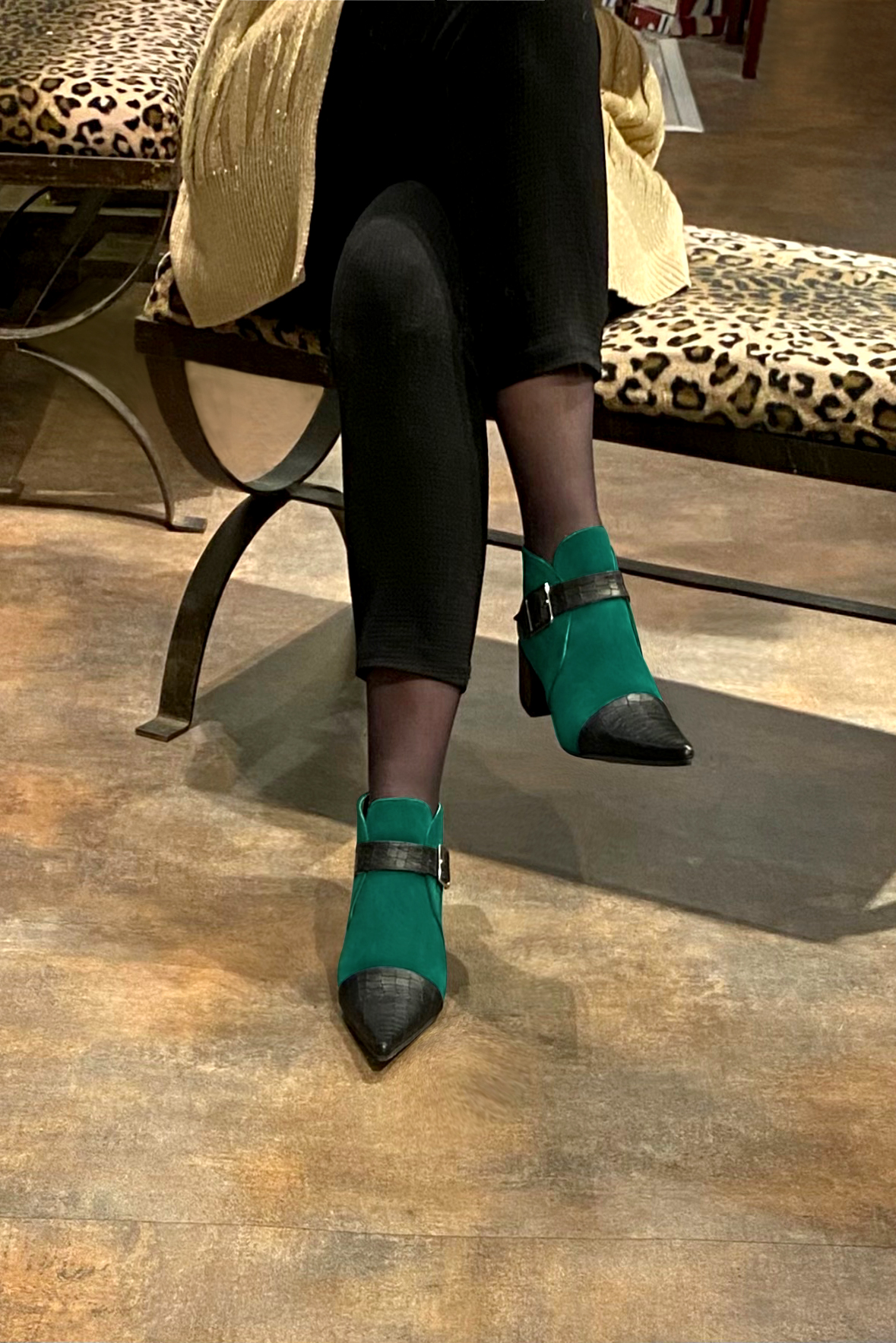 Satin black and emerald green women's ankle boots with buckles at the front. Pointed toe. Medium block heels. Worn view - Florence KOOIJMAN